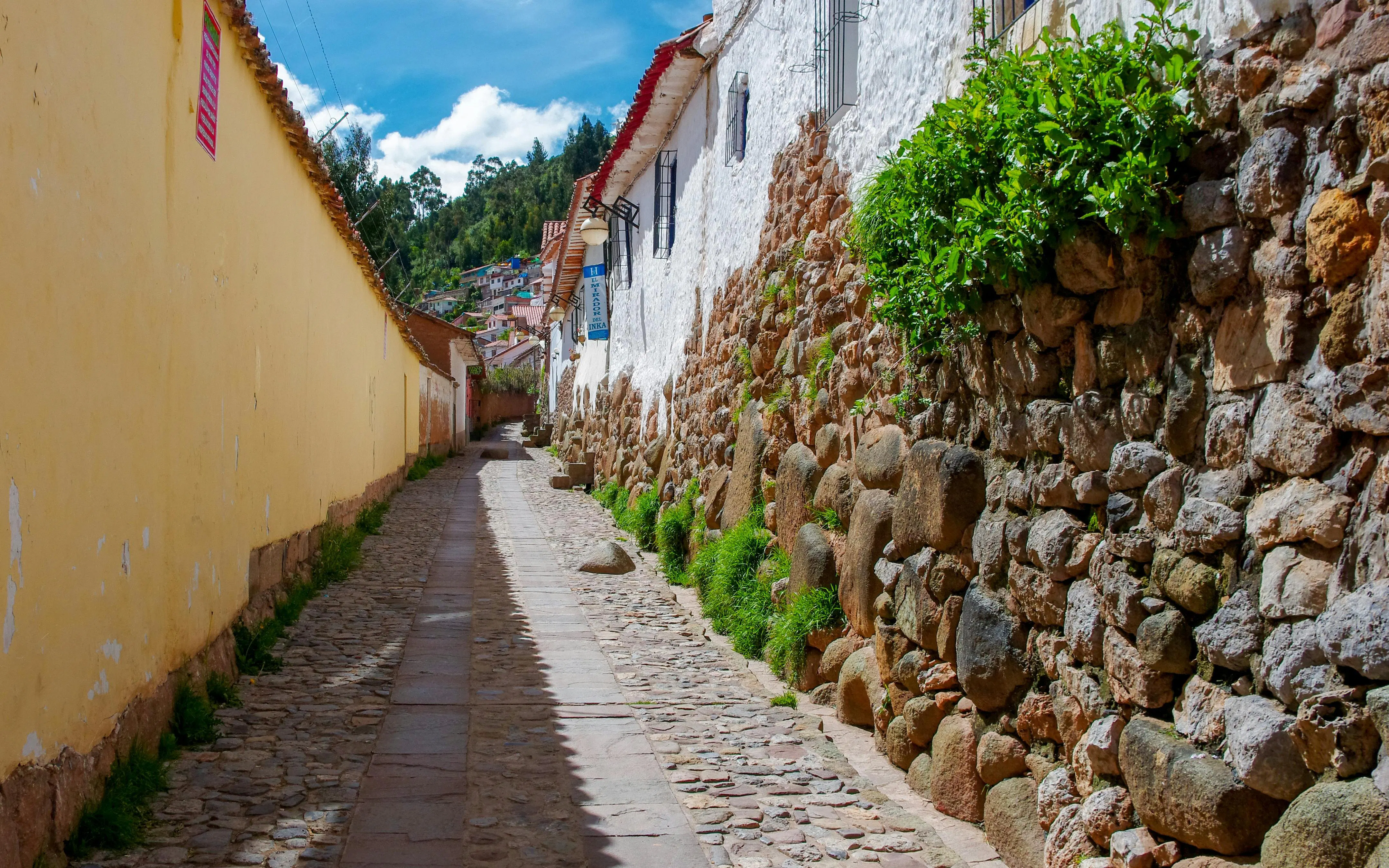 Cobbled street with stone walls in Cuzco, Peru.