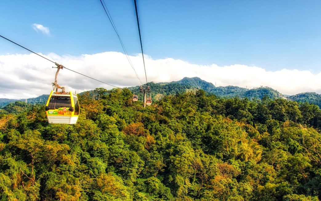 Maokong Gondola over lush green hills in Taipei, Taiwan.