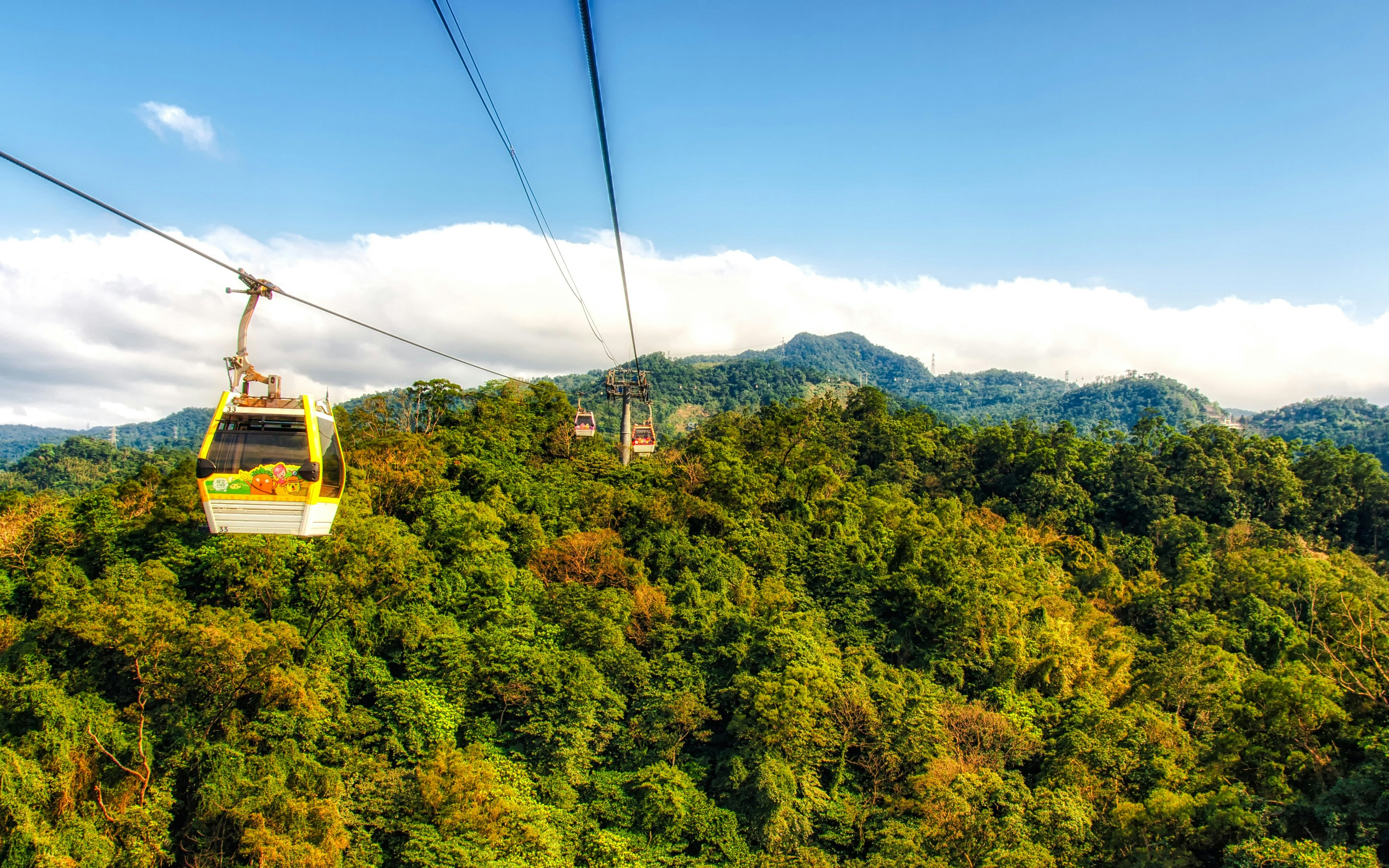 Maokong Gondola over lush green hills in Taipei, Taiwan.
