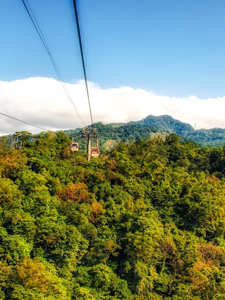Maokong Gondola over lush green hills in Taipei, Taiwan.