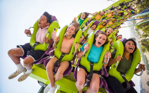 Riders on Medusa roller coaster at Six Flags Discovery Kingdom, California.