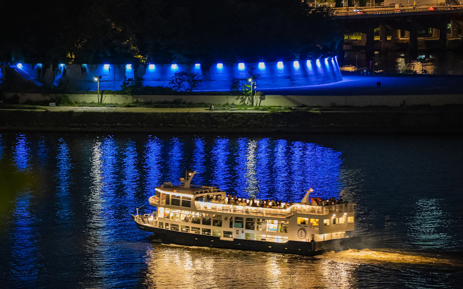 Cruise boat on Han River at night with blue lights, Starlight Cruise, Eland Cruise, Seoul.