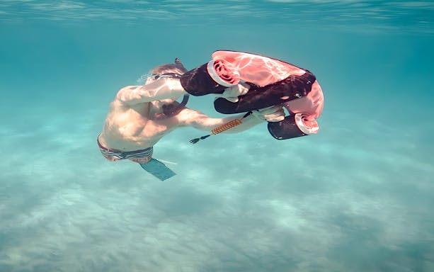 Underwater scooter exploring sculptures in Underwater Museum of Marseille, France.