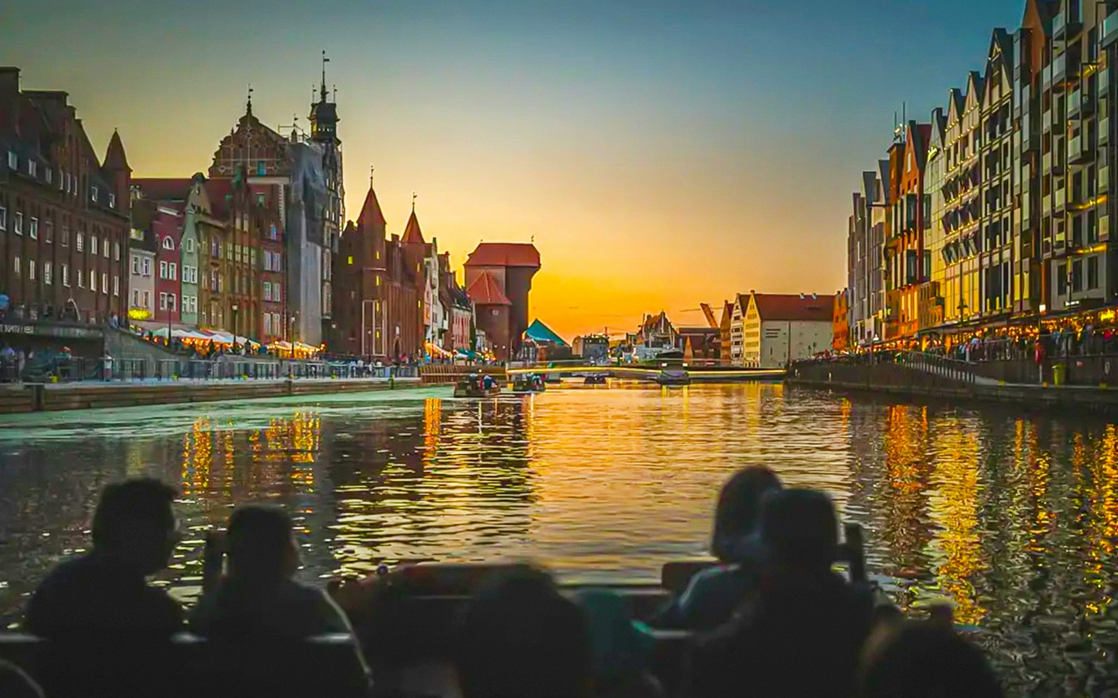 Gdansk Old Town view from a historical boat during sunset river cruise.