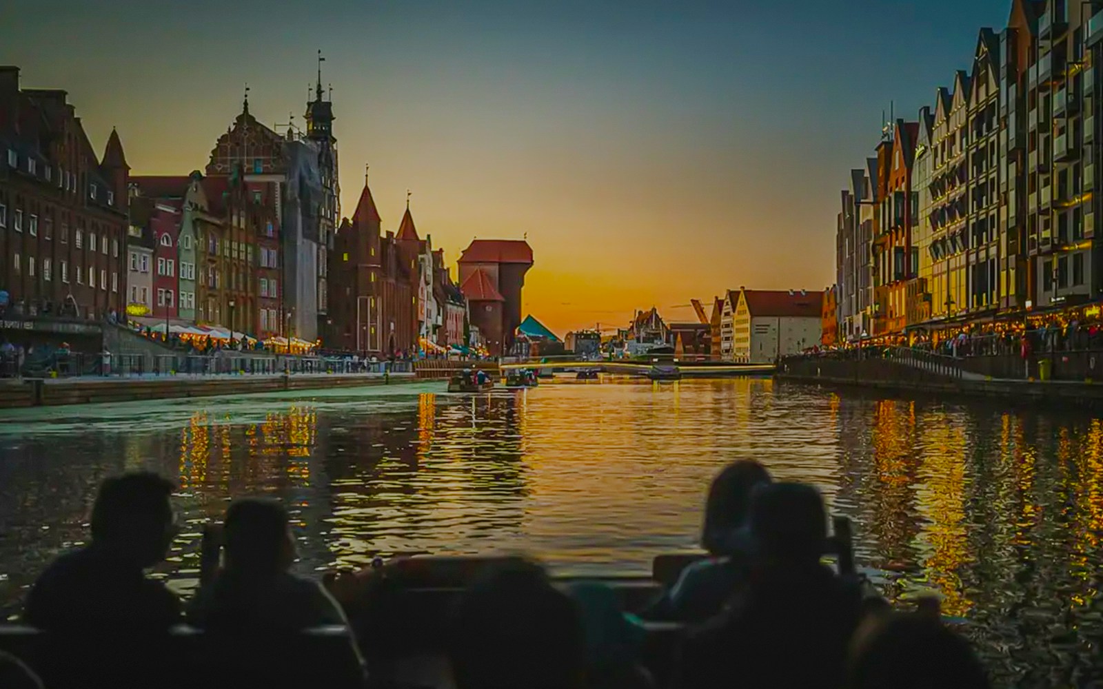 Gdansk Old Town view from a historical boat during sunset river cruise.