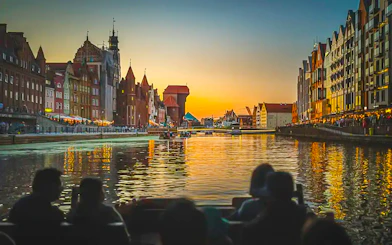 Gdansk Old Town view from a historical boat during sunset river cruise.