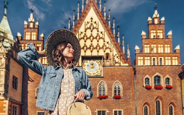 Wroclaw Town Hall with a visitor in front, part of the Wroclaw Small-Group Tour from Warsaw.
