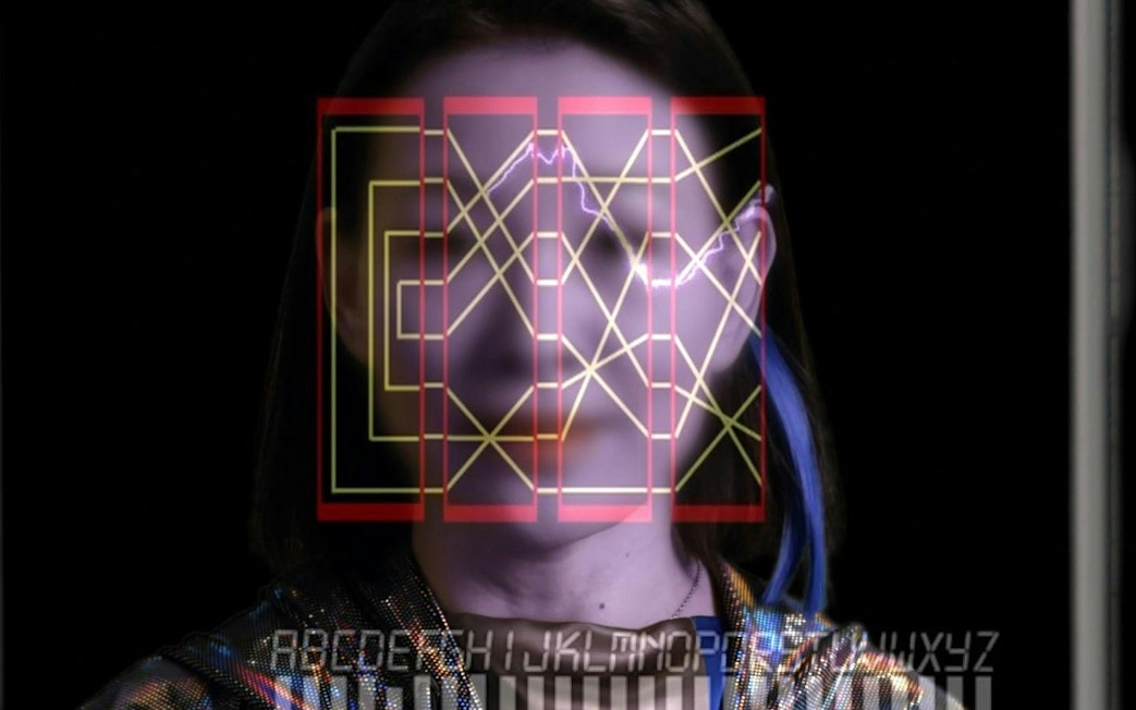 Geometric patterns overlaying a face, part of "Data Dreams: Art and AI" at Art Gallery of New South Wales, Sydney.