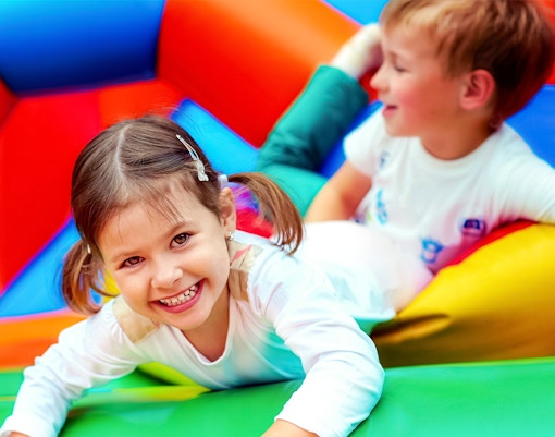happy kids in bouncy castle