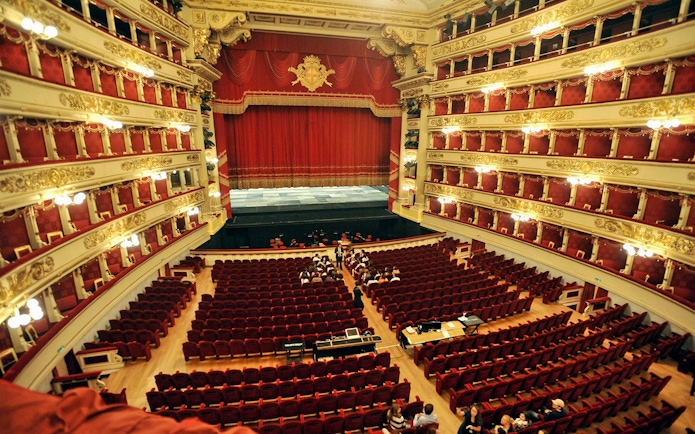 La Scala theater interior with red seats and ornate balconies, Milan.