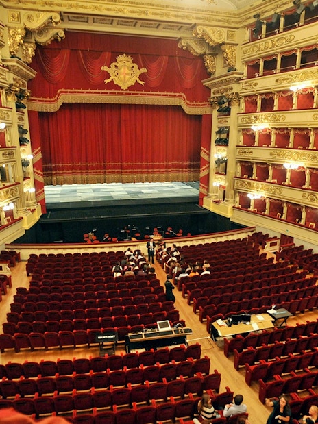 La Scala theater interior with red seats and ornate balconies, Milan.