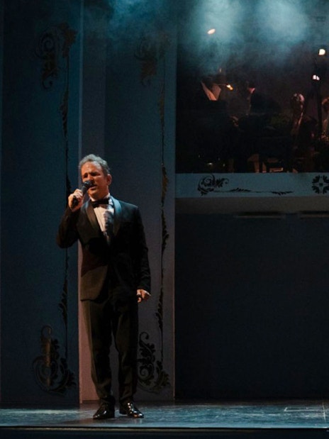 Performers singing at Café de los Angelitos Tango Show in Buenos Aires.