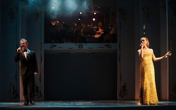 Performers singing at Café de los Angelitos Tango Show in Buenos Aires.