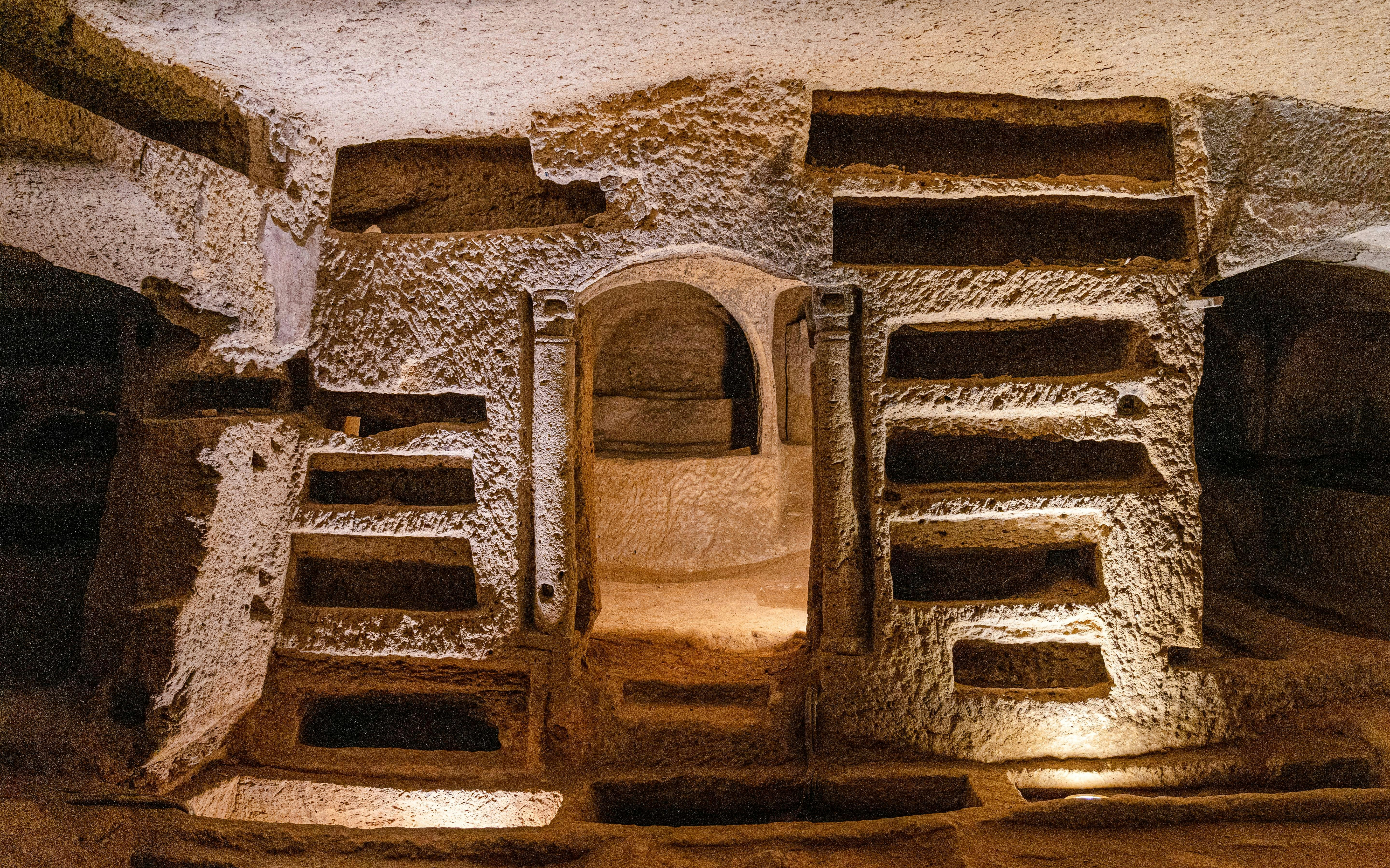 Catacombs of San Gennaro, ancient burial niches and archway in Naples, Italy.