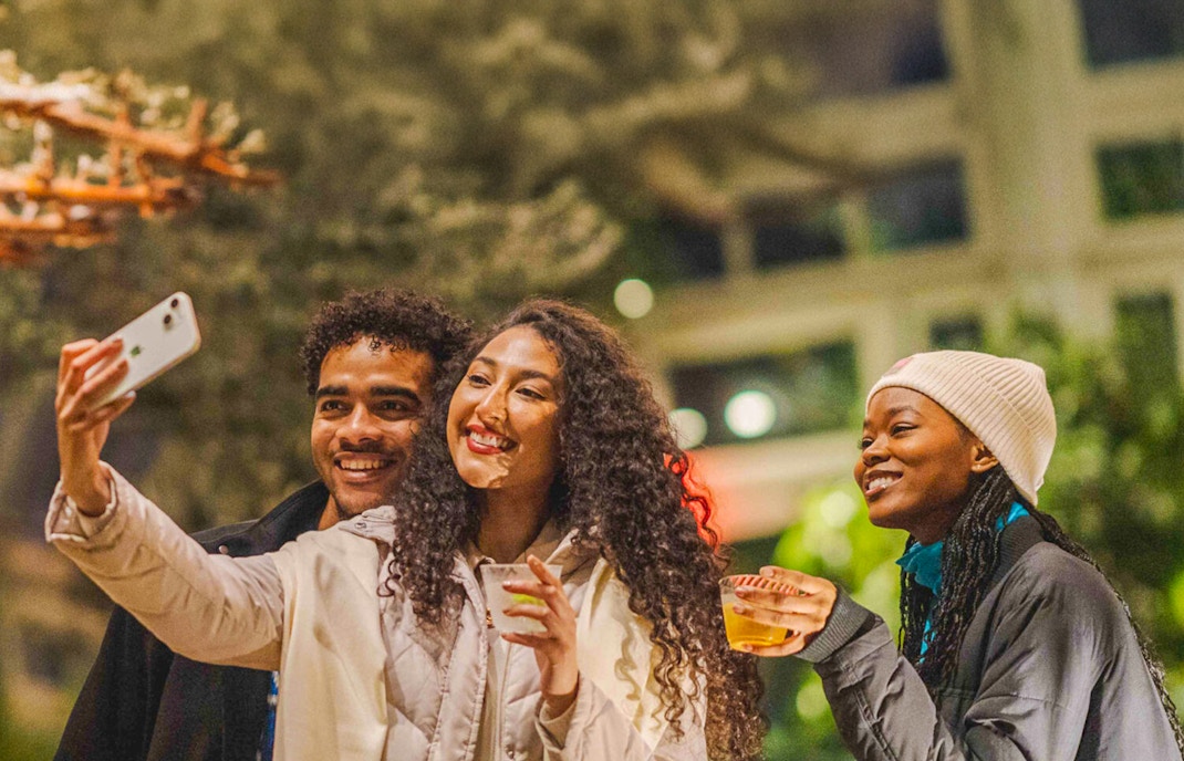 Visitors exploring vibrant flora at New York Botanical Gardens.