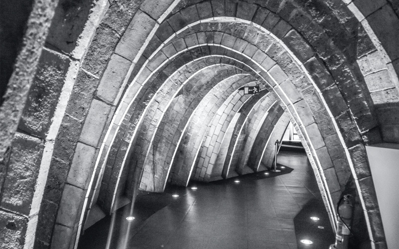 Casa Mila's Whale Attic with stone arches in Barcelona.