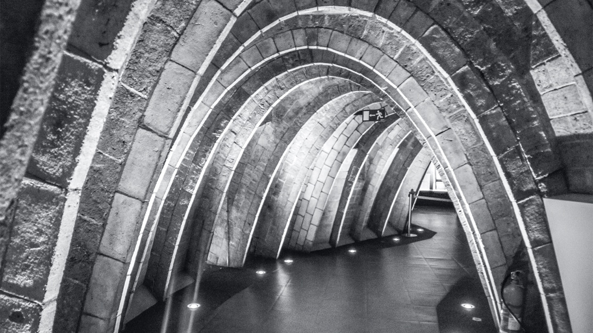 Casa Mila's Whale Attic with stone arches in Barcelona.