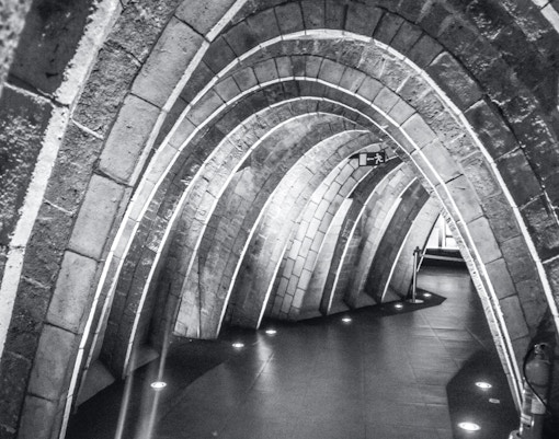 Casa Mila's Whale Attic with unique architectural arches in Barcelona, Spain.
