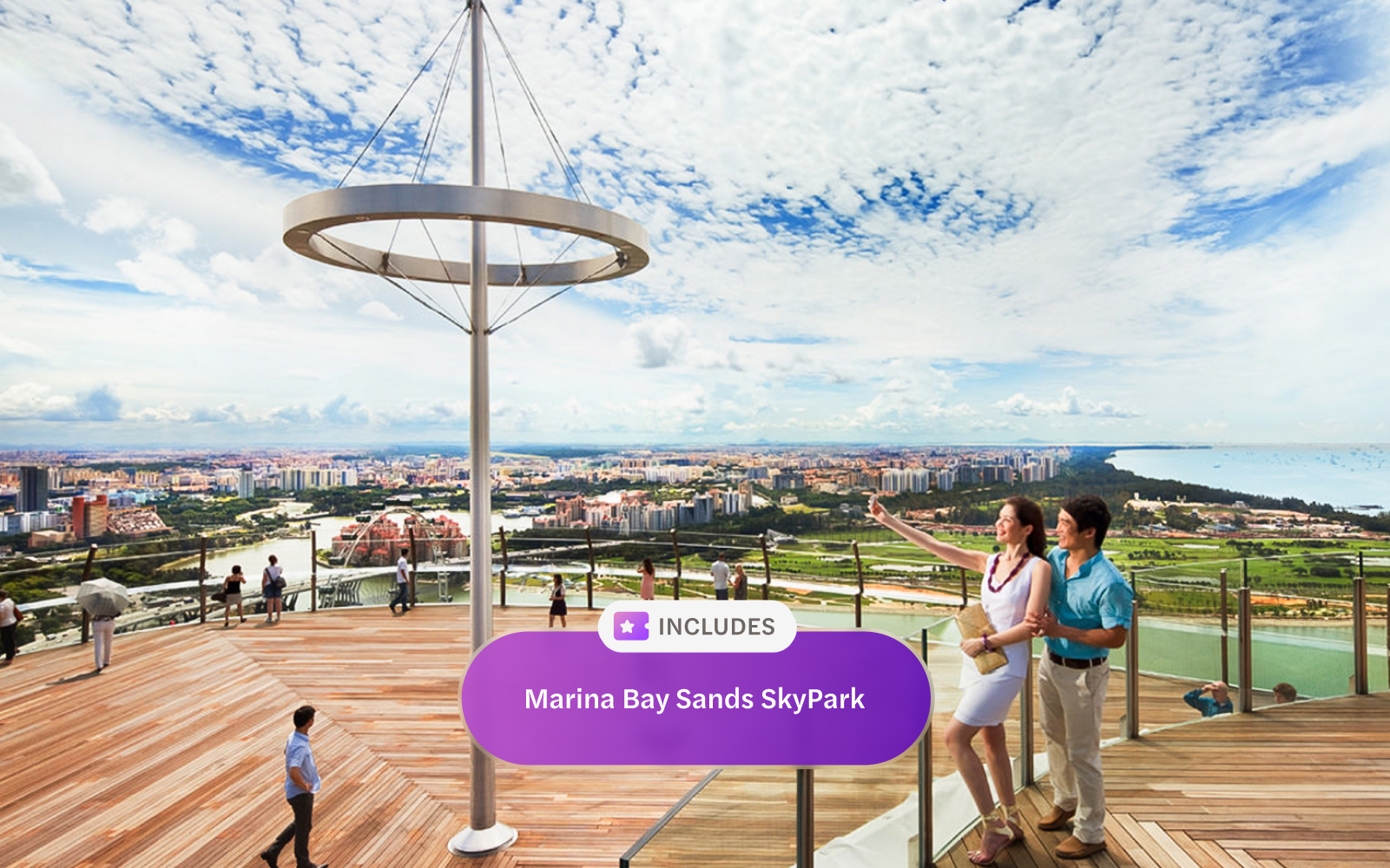 Visitors on Marina Bay Sands SkyPark Observation Deck, overlooking Singapore cityscape.