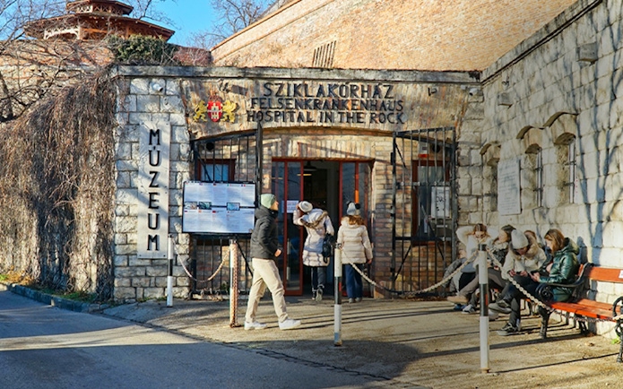 Visitors entering the Rock Nuclear Bunker Museum in Budapest.