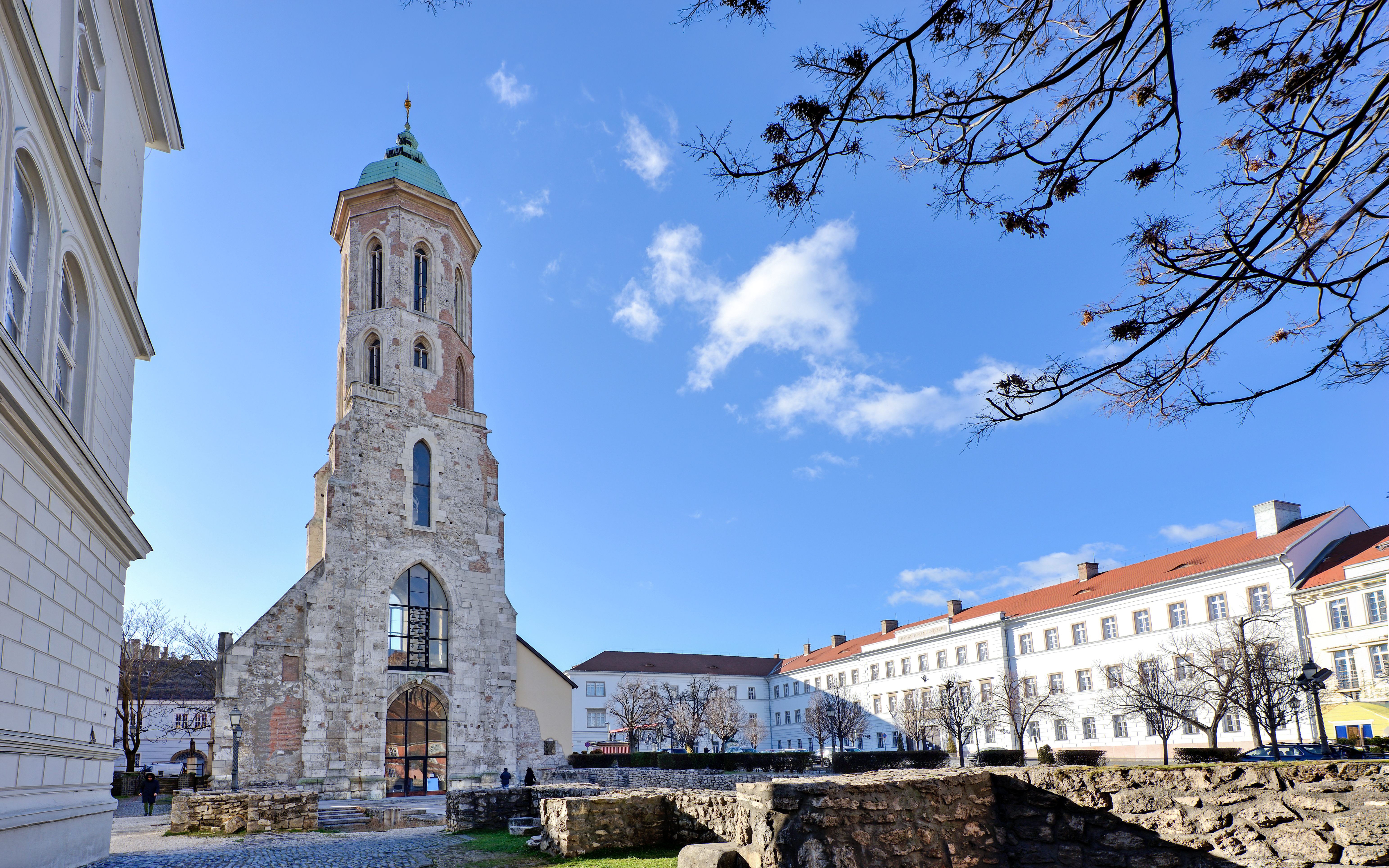 Church of Mary Magdalene tower in Budapest, Hungary, with surrounding historic buildings.