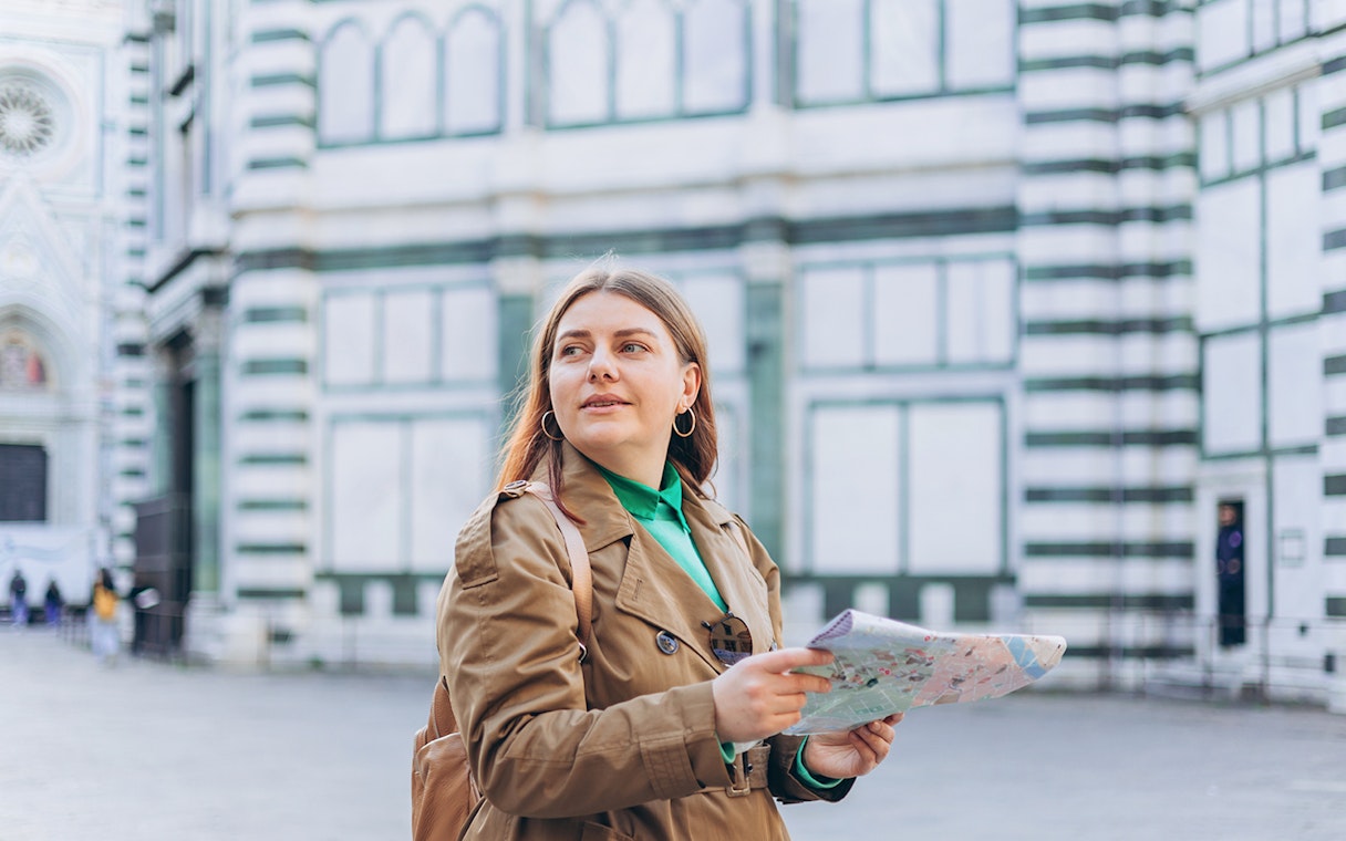 Female guide with map at Duomo Complex, Florence.