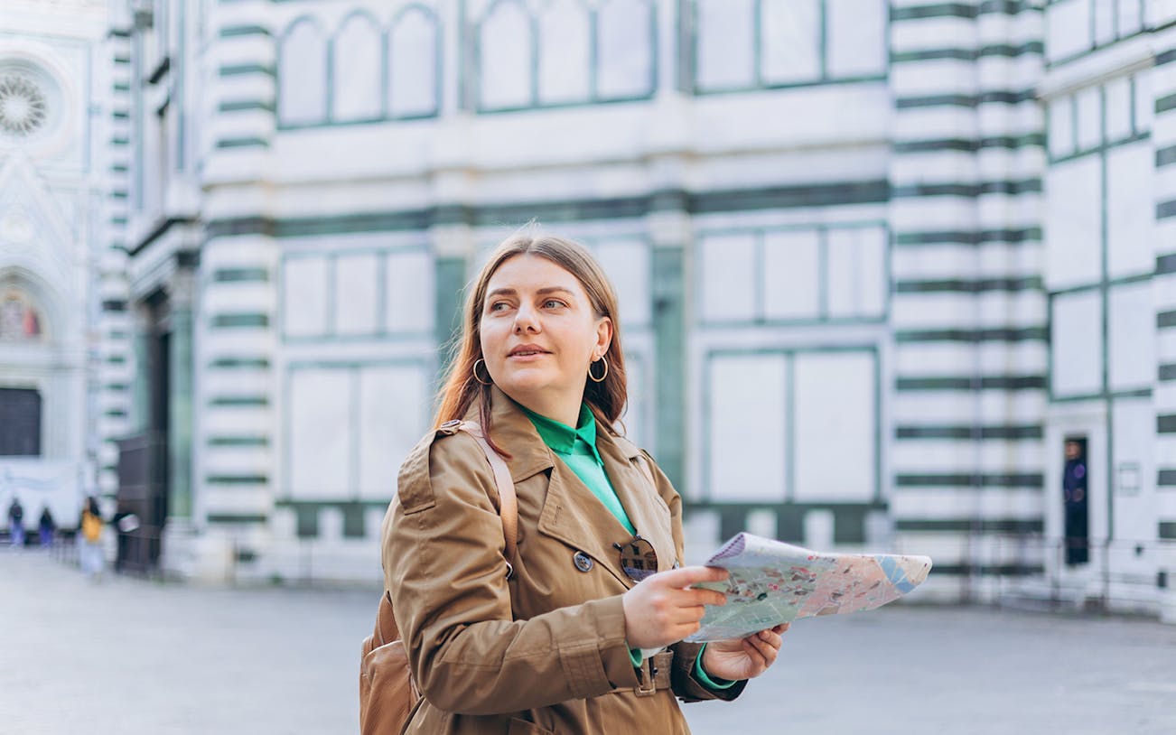 Female guide with map at Duomo Complex, Florence.
