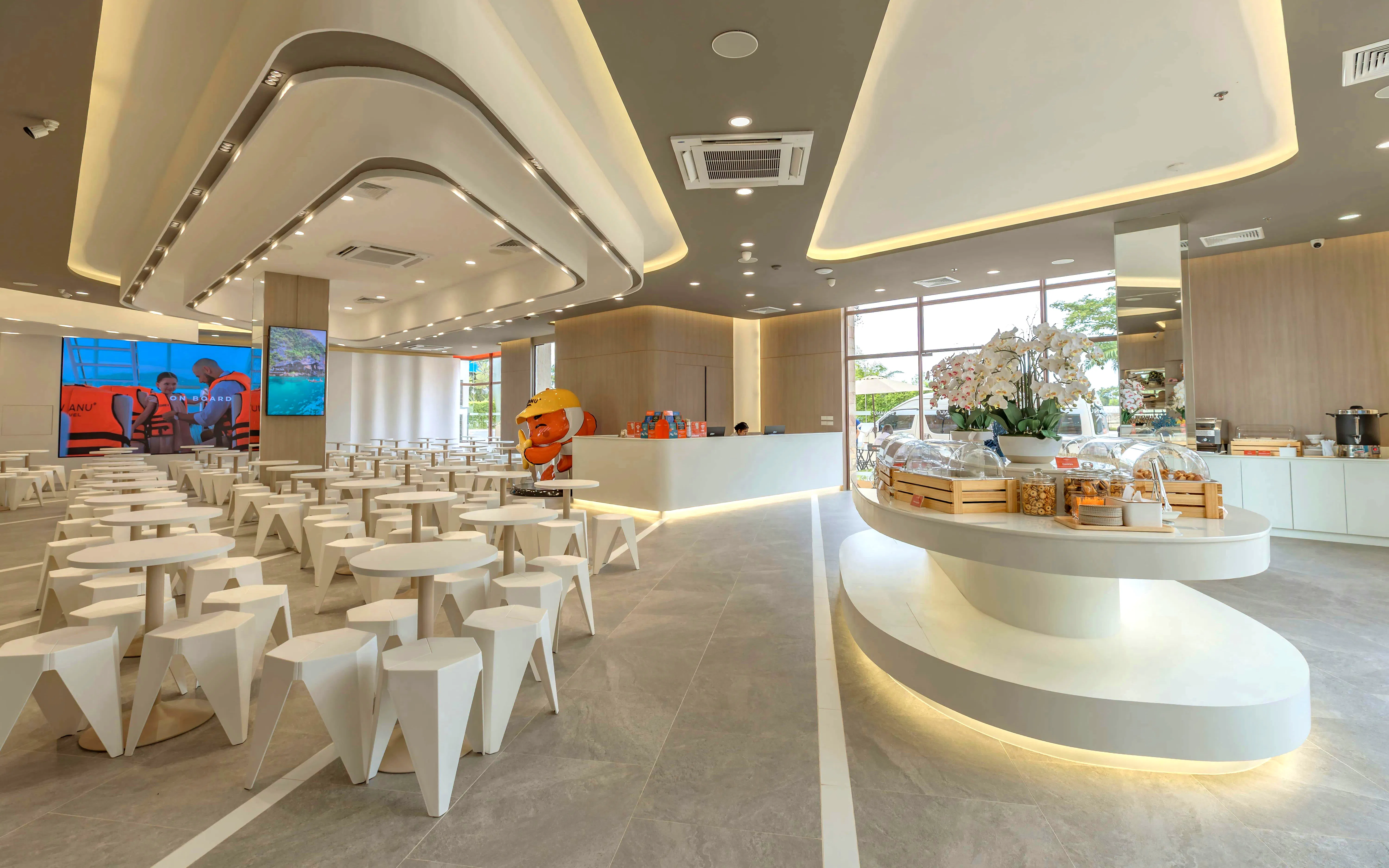Modern waiting area for Phuket: Phi Phi & Khai Islands speedboat tour with seating and refreshments.