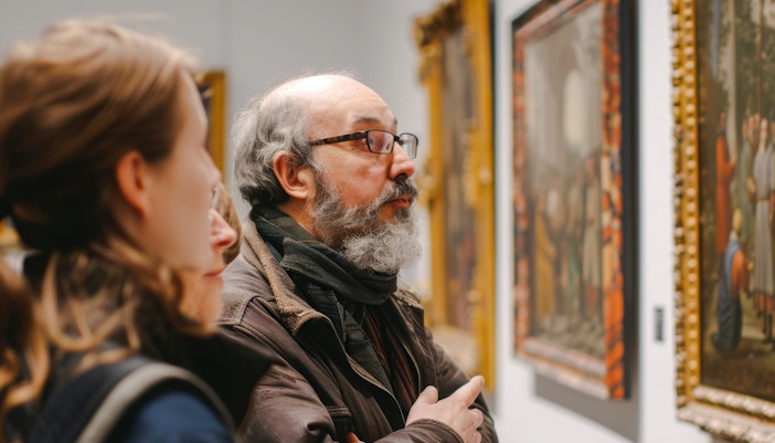 Visitors exploring an art gallery