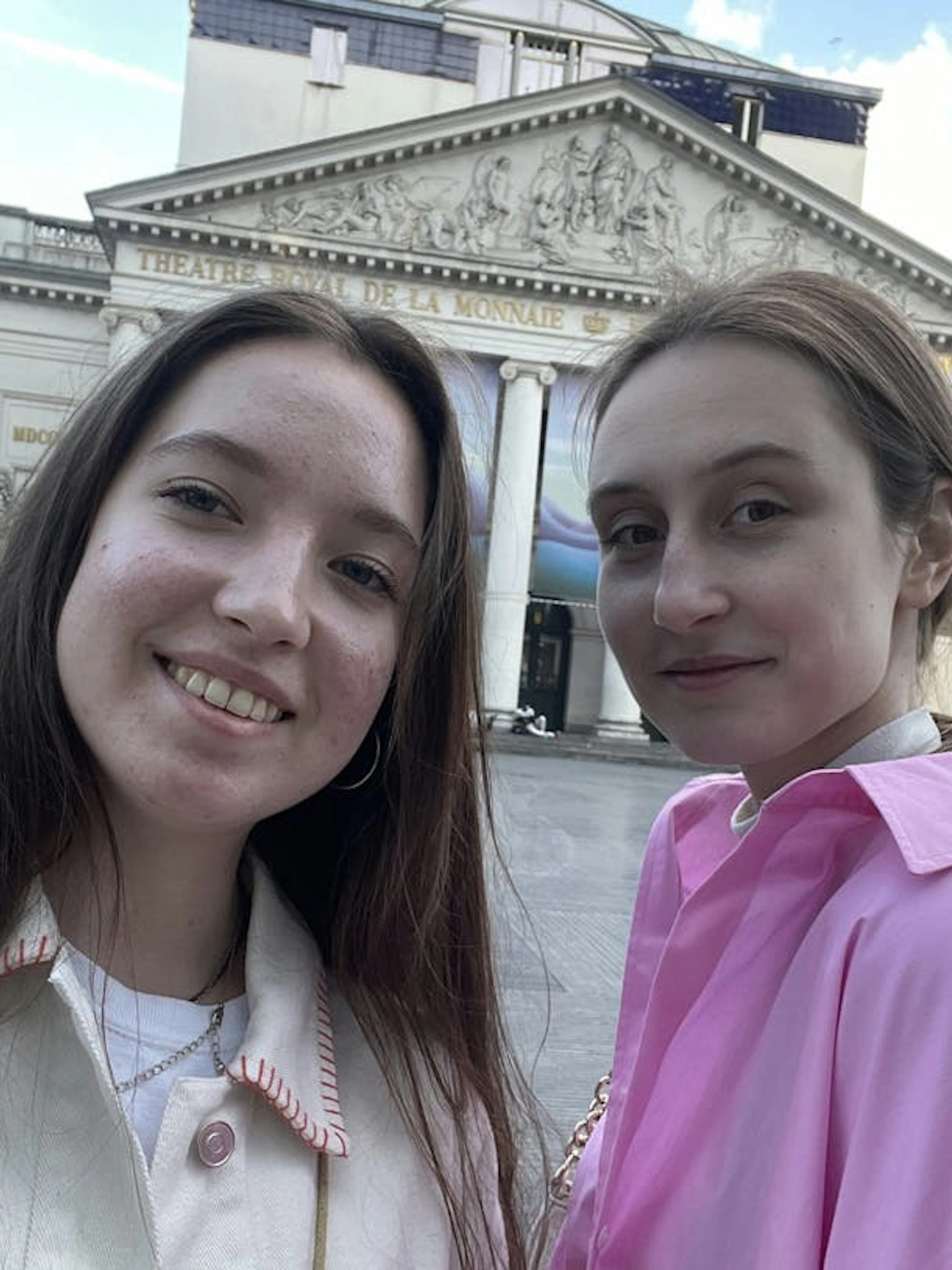 Two people in front of Théâtre Royal de la Monnaie, Brussels.