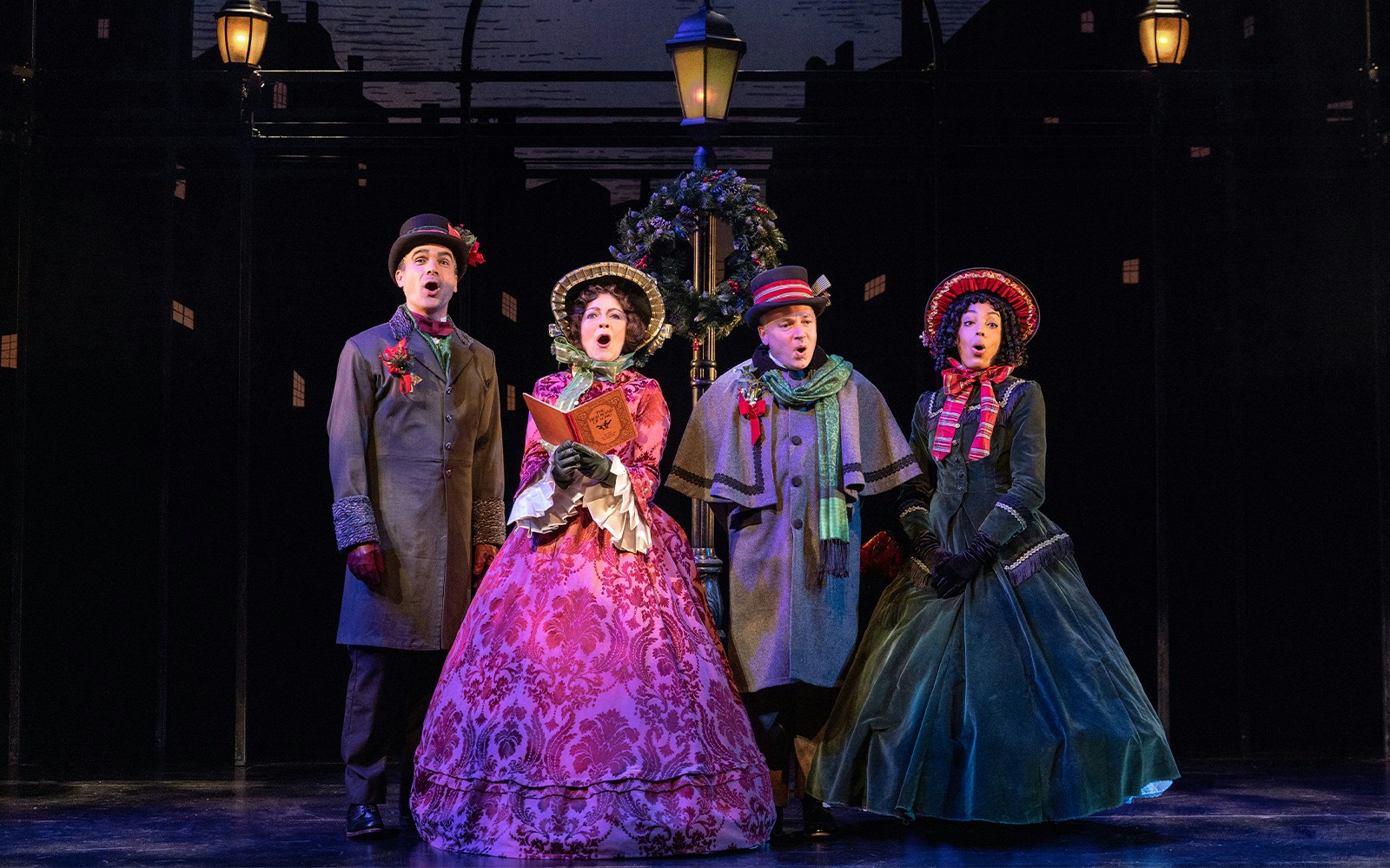 Victorian carolers performing in "A Sherlock Carol" stage production.