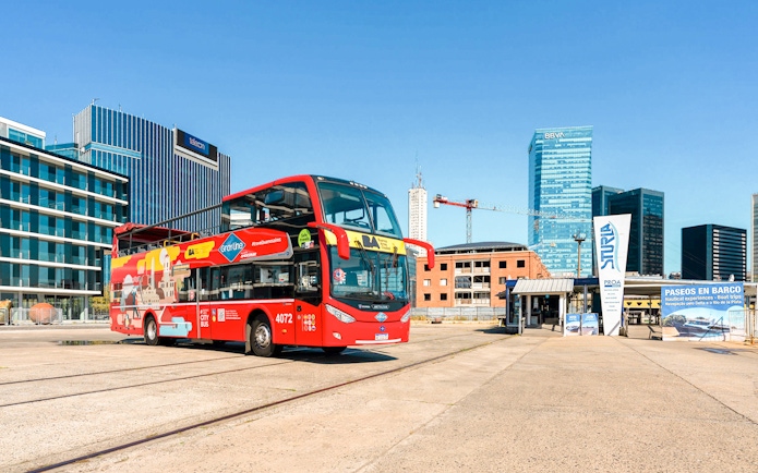 Gray Line City bus in front of Telecon building, Buenos Aires, hop on hop off tour.
