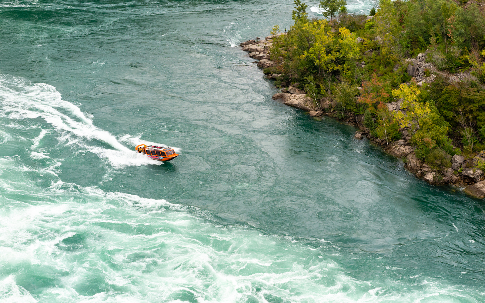 Jet boat navigating rapids in Niagara Gorge, Canada.