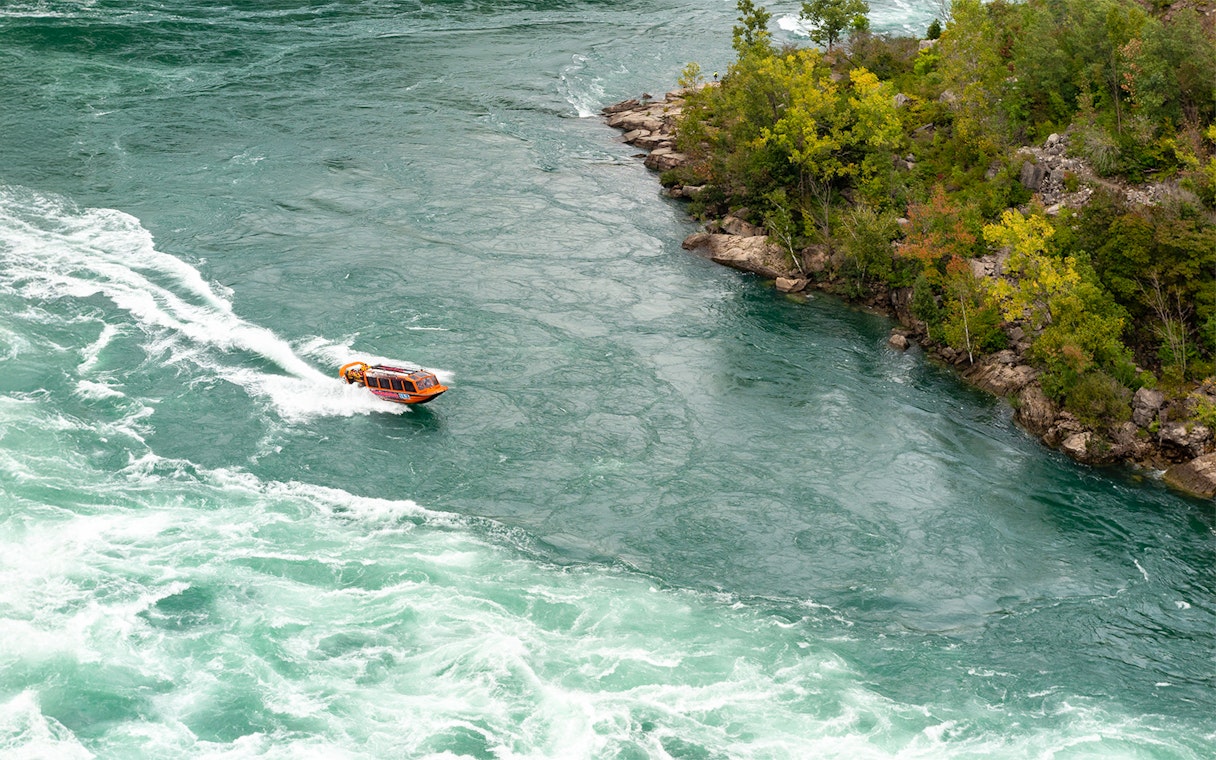 Jet boat navigating rapids in Niagara Gorge, Canada.