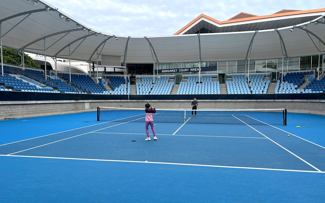 Tennis players on court at Margaret Court Arena, Melbourne Park.