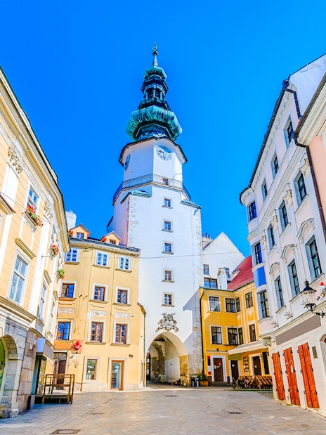 Michael's Gate in Bratislava's Old Town, surrounded by historic buildings.