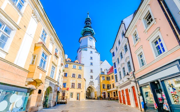 Michael's Gate in Bratislava's Old Town, surrounded by historic buildings.