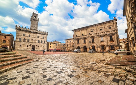 Piazza Grande in Montepulciano, Italy, with historic buildings on a Val D’Orcia tour.