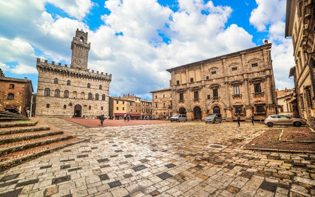 Piazza Grande in Montepulciano, Italy, with historic buildings on a Val D’Orcia tour.