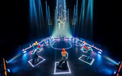 Stage performance of Hunger Games West End show with actors in formation.