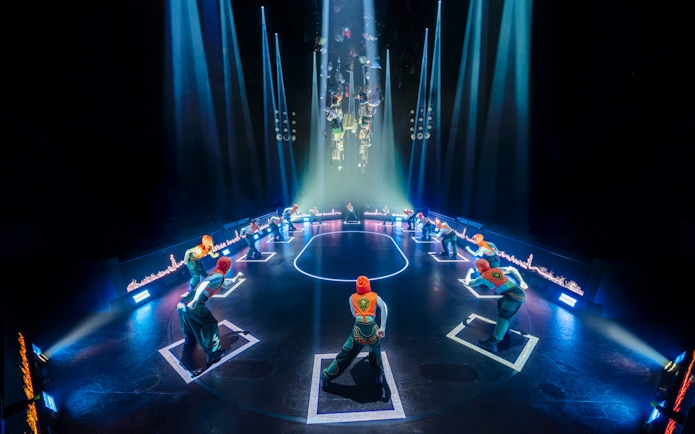 Stage performance of Hunger Games West End show with actors in formation.