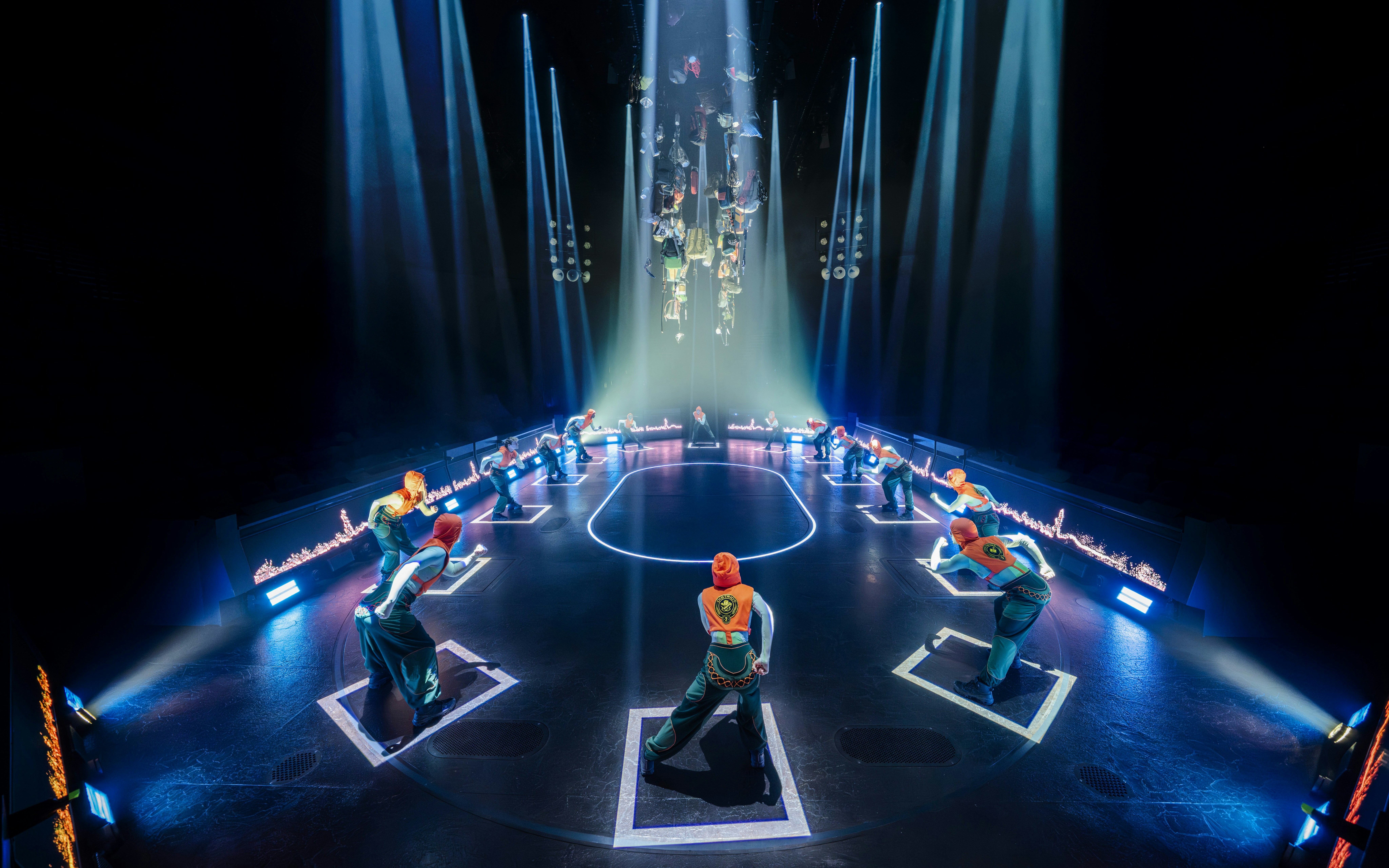 Stage performance of Hunger Games West End show with actors in formation.