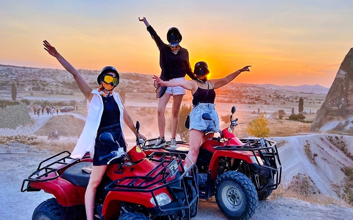 Guests on ATVs enjoying a sunset tour in Cappadocia.