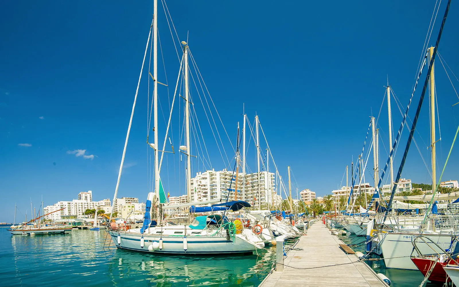 Sailboats docked at the marina in Sant Antoni de Portmany, Ibiza.