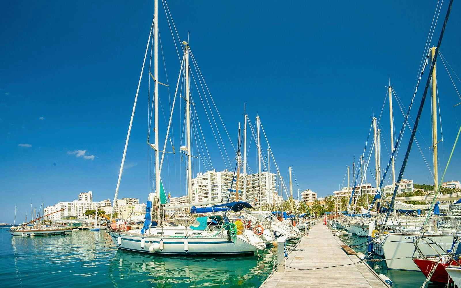 Sailboats docked at the marina in Sant Antoni de Portmany, Ibiza.