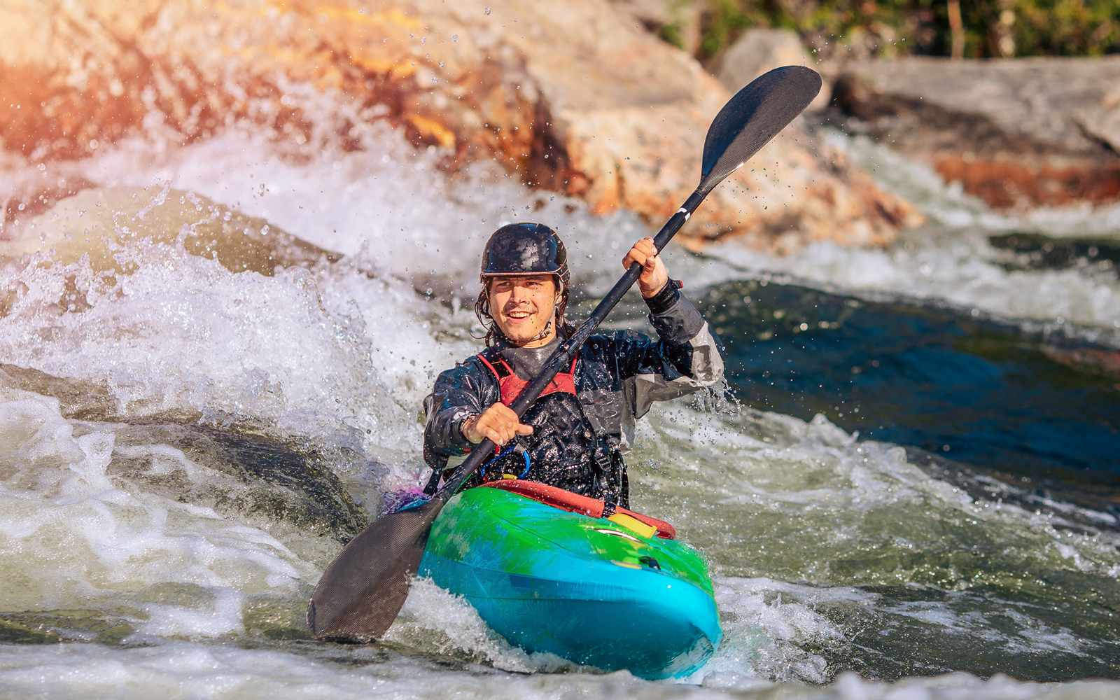 Tourists enjoying water sports on a sunny beach in Bali, Indonesia.