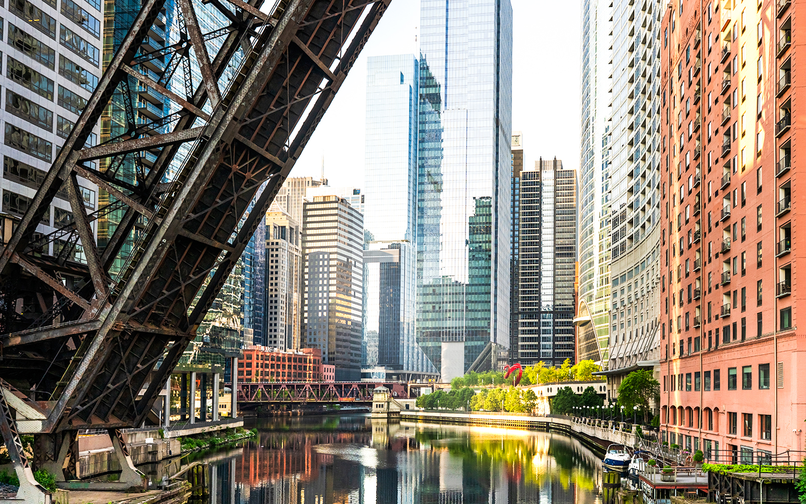 Downtown Chicago skyline with raised bridge over the river.