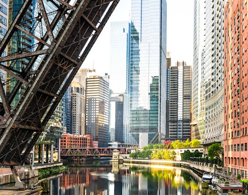 Downtown Chicago skyline with raised bridge over the river.