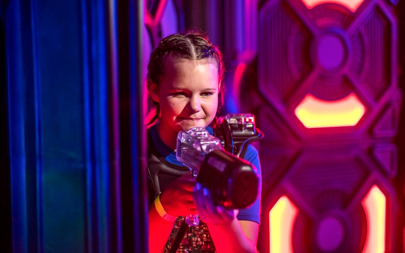 Child playing laser tag at Wonderworks.