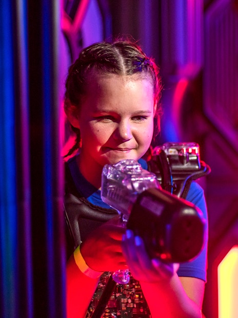 Child playing laser tag at Wonderworks.